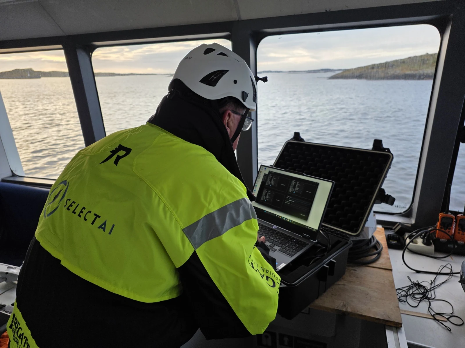 SelectAI floating unit deployed alongside a salmon cage at Karmøy, December 2025